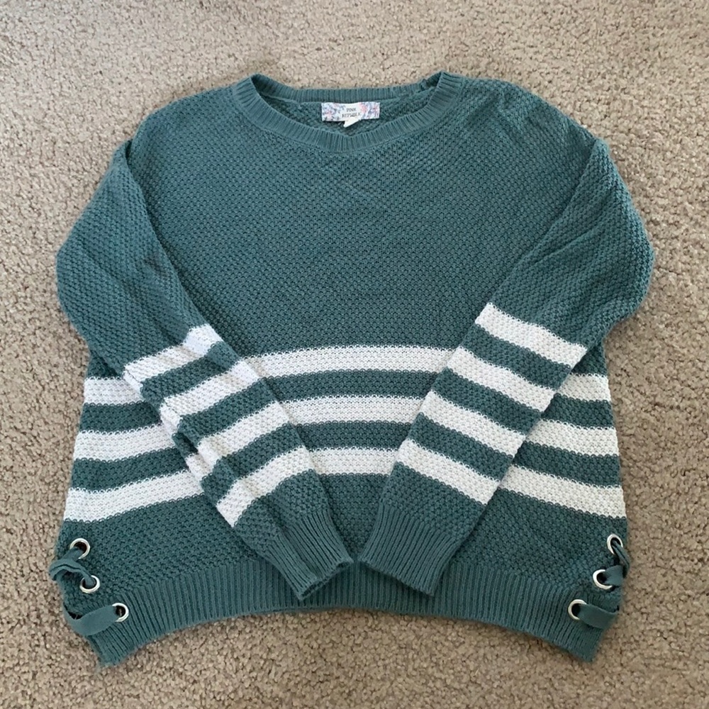 Green sweater, with lace up detailing on the sides